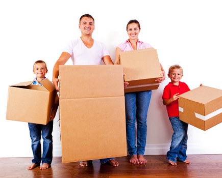 Moving team protecting furniture during a Holland Park van move