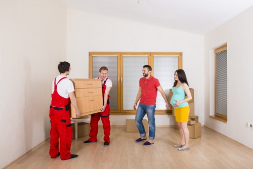 Customer and removals team confirming a moving job and access details