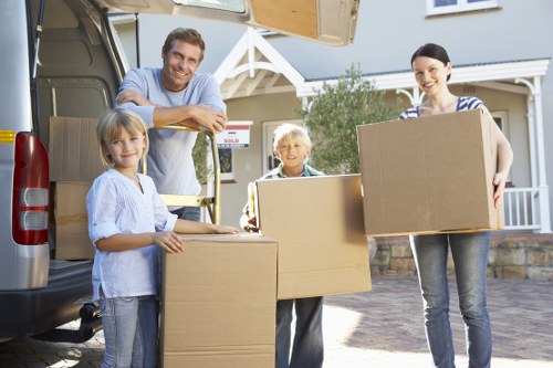 Professional unpacking service placing items in the right rooms after a move