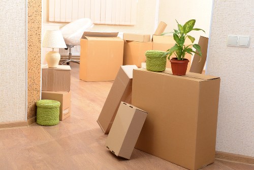 Removal team loading furniture for a Holland Park move